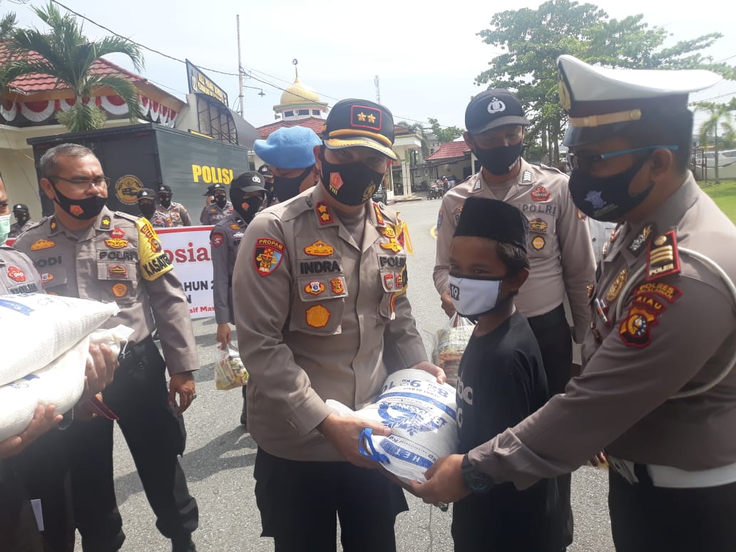 Polres Pelalawan Gelar Bhakti Sosial dan Pelepasan Tim Pengantar Sembako