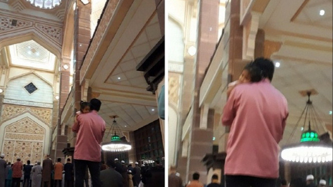 Salat Tarawih Sambil Gendong Putrinya, Ayah Ini Tuai Pujian