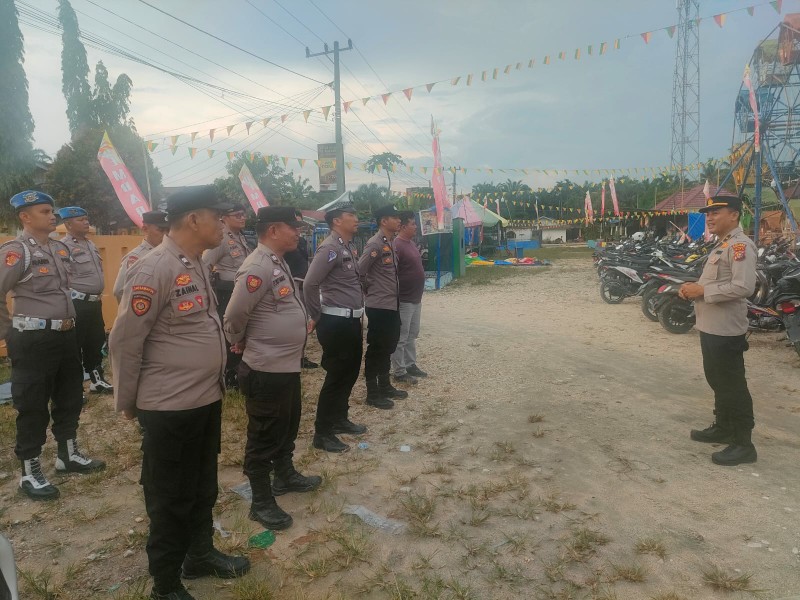 Personel Polres Kuansing Pengamanan Kampanye Pilkada 2024 Paslon Cabup-Cawabup di Kecamatan Singingi Hilir