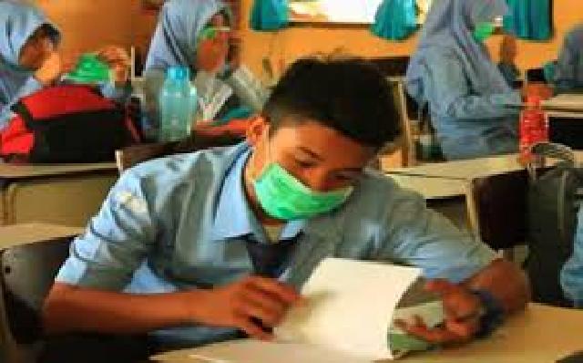 Siswa SMPN 8 Pekanbaru TO Pakai Masker Bantuan BLH Riau