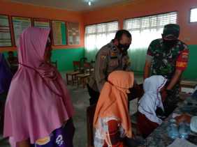 Polsek Bandar Sei Kijang Terus Bantu Proses Percepatan Vaksinasi, Berikut Datanya 