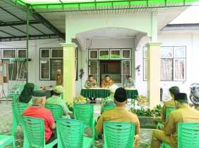 Polsek Tambang Hadiri Penetapan Alamat Desa dan Evaluasi Dana Desa Sawah Baru 2024