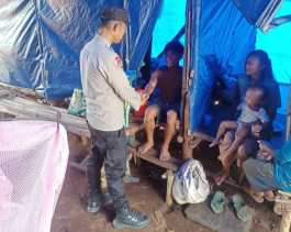 Bhabin Polsek Langgam Kawal Pilkada Damai di Desa Penarikan